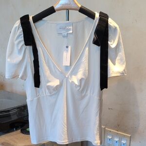 Anthropologie Cream Blouse with Black Velvet Bow Accents